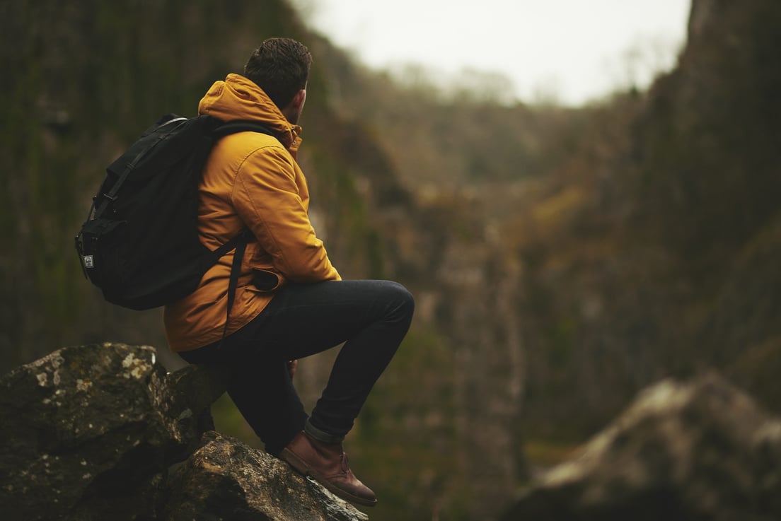 Backpacker in Mountain Trek